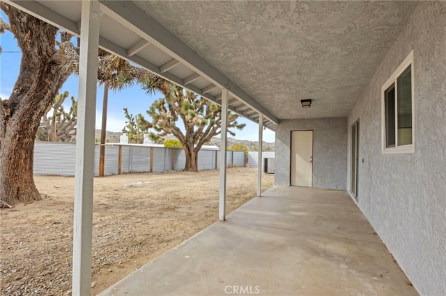 7010 Airway Ave, Yucca Valley, CA 92284 - fenced backyard featuring a patio