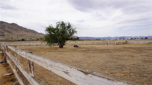 9322 Candlelight St, Apple Valley, CA 92308 - view of yard with a mountain view, a view of countryside, and an enclosed horse arena