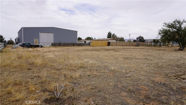 9322 Candlelight St, Apple Valley, CA 92308 - view of yard with a pole building and an outbuilding