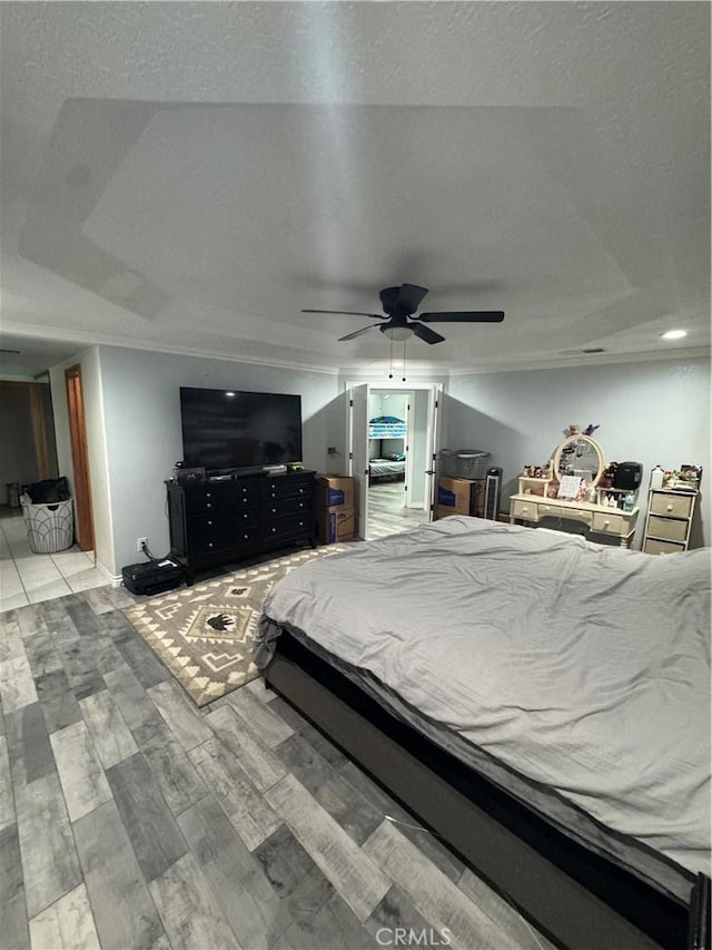 9322 Candlelight St, Apple Valley, CA 92308 - bedroom with wood finished floors, a ceiling fan, a textured ceiling, and recessed lighting
