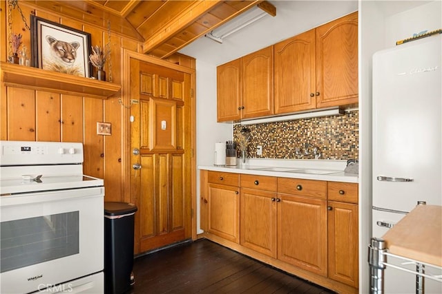 664 Yukon Rd, Green Valley Lake, CA 92341 - kitchen featuring white appliances, decorative backsplash, dark wood-style flooring, light countertops, and brown cabinets