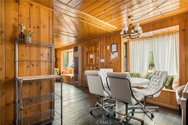 664 Yukon Rd, Green Valley Lake, CA 92341 - dining space featuring wooden ceiling, wooden walls, a chandelier, and hardwood / wood-style floors