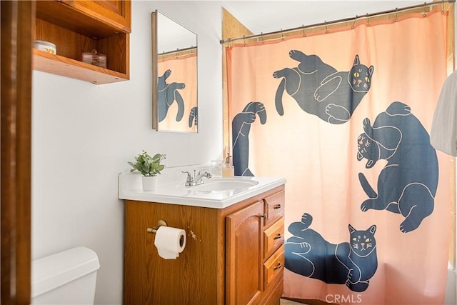 664 Yukon Rd, Green Valley Lake, CA 92341 - bathroom featuring toilet, vanity, and a shower with shower curtain