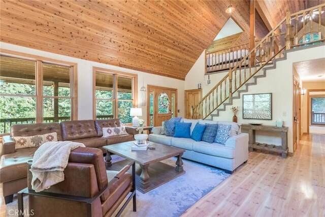 1900 Maple Dr, Weed, CA 96094 - living area with high vaulted ceiling, stairs, wood finished floors, and wooden ceiling
