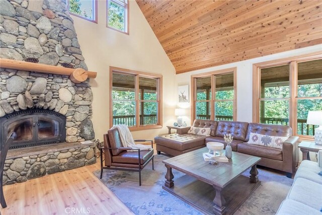 1900 Maple Dr, Weed, CA 96094 - living room with high vaulted ceiling, plenty of natural light, wood finished floors, wooden ceiling, and a fireplace