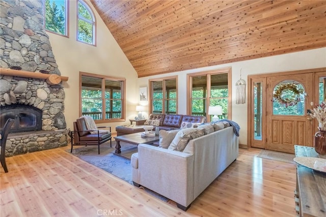 1900 Maple Dr, Weed, CA 96094 - living room with high vaulted ceiling, light wood-style flooring, a fireplace, and wood ceiling