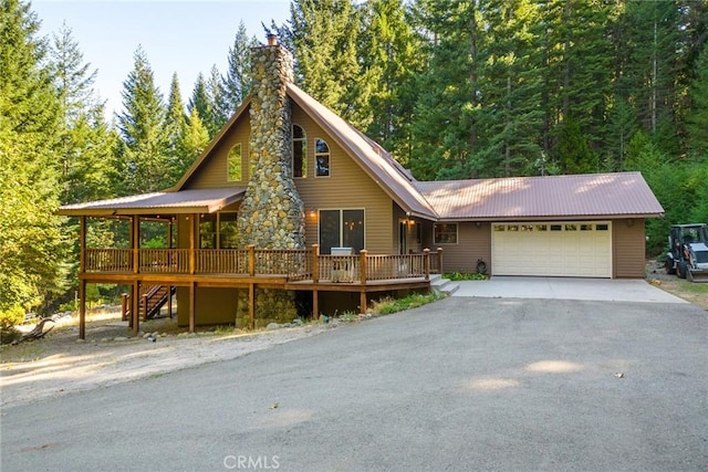 1900 Maple Dr, Weed, CA 96094 - view of front facade with asphalt driveway, a garage, a wooden deck, and stairs
