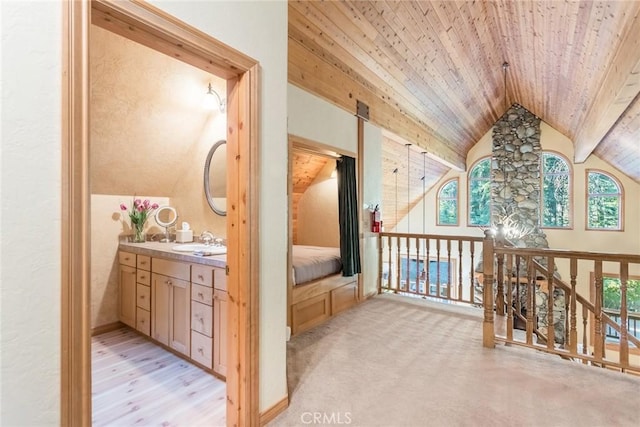1900 Maple Dr, Weed, CA 96094 - hallway with vaulted ceiling, a sink, plenty of natural light, wooden ceiling, and light colored carpet