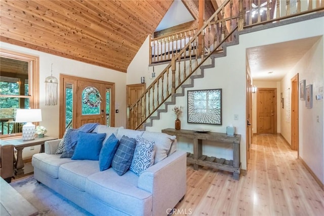 1900 Maple Dr, Weed, CA 96094 - living area with light wood finished floors, high vaulted ceiling, stairway, and wooden ceiling