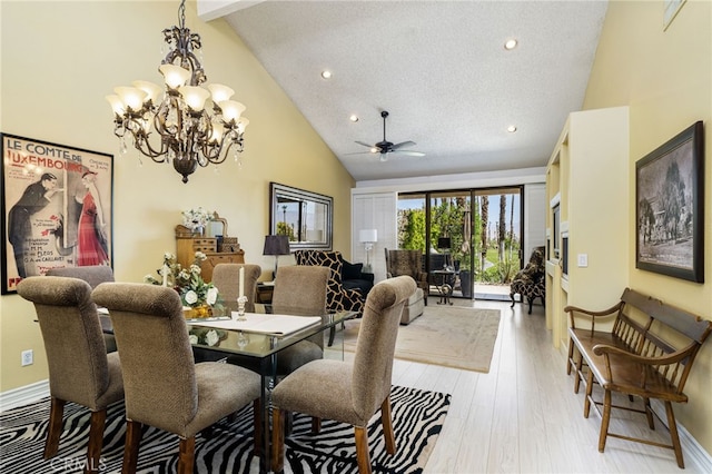 76022 Honeysuckle Dr, Palm Desert, CA 92211 - dining area with high vaulted ceiling, a ceiling fan, a chandelier, light wood-style floors, and recessed lighting