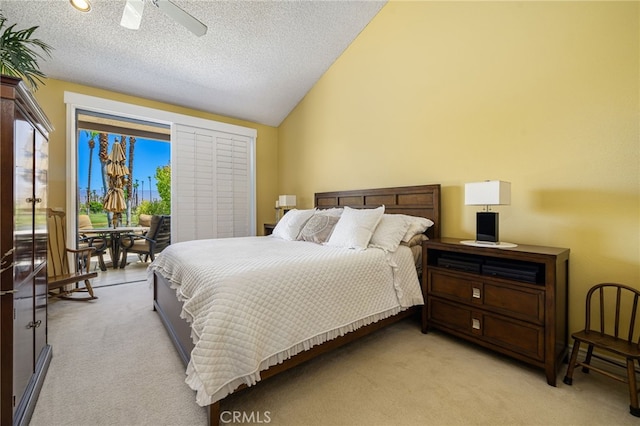 76022 Honeysuckle Dr, Palm Desert, CA 92211 - bedroom featuring vaulted ceiling, multiple windows, light colored carpet, access to outside, and a textured ceiling