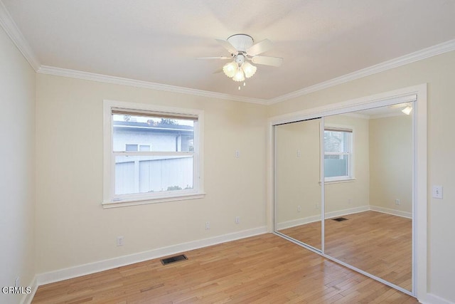 3115 Evelyn St, La Crescenta, CA 91214 - unfurnished bedroom with light wood-style flooring, multiple windows, ornamental molding, and baseboards