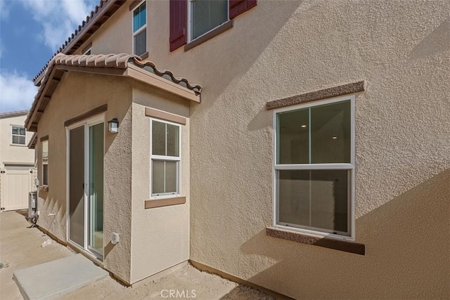 16017 E Preserve Loop, Chino, CA 91708 - view of side of property featuring stucco siding, a tiled roof, and a patio area