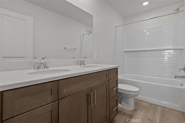 16017 E Preserve Loop, Chino, CA 91708 - bathroom featuring double vanity, wood finished floors, and shower / tub combination