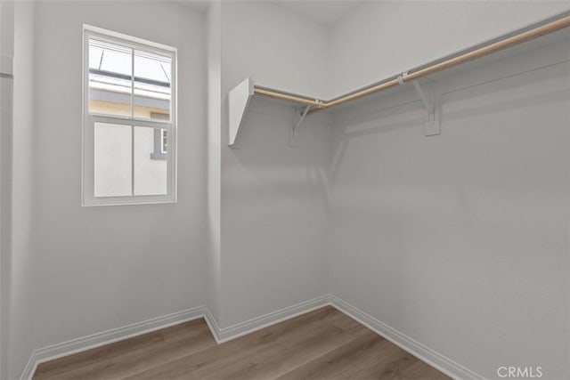 16017 E Preserve Loop, Chino, CA 91708 - walk in closet featuring wood finished floors