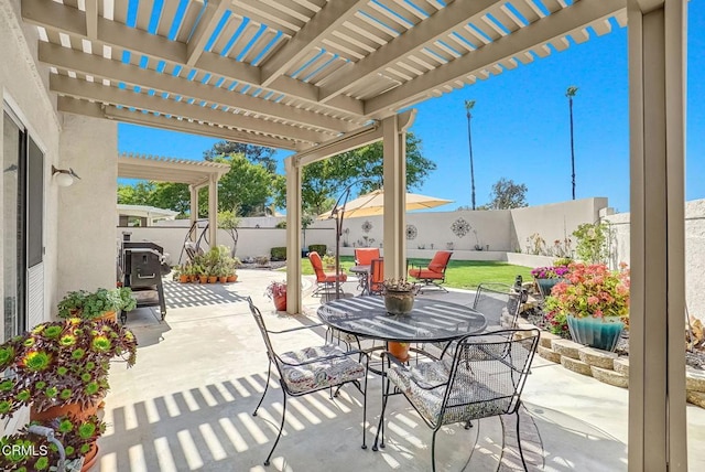 885 Oakland Hills Dr, Banning, CA 92220 - fenced backyard with outdoor dining space, a patio area, and a pergola