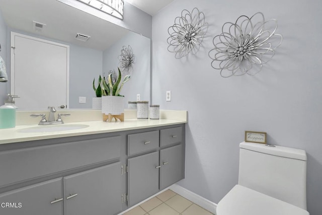885 Oakland Hills Dr, Banning, CA 92220 - bathroom featuring vanity, toilet, and tile patterned floors
