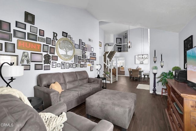 885 Oakland Hills Dr, Banning, CA 92220 - living area with stairs, lofted ceiling, wood finished floors, and baseboards