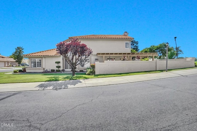 885 Oakland Hills Dr, Banning, CA 92220 - mediterranean / spanish home featuring a chimney, a tiled roof, and stucco siding