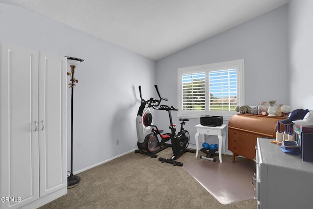 885 Oakland Hills Dr, Banning, CA 92220 - exercise area with vaulted ceiling, carpet floors, and baseboards
