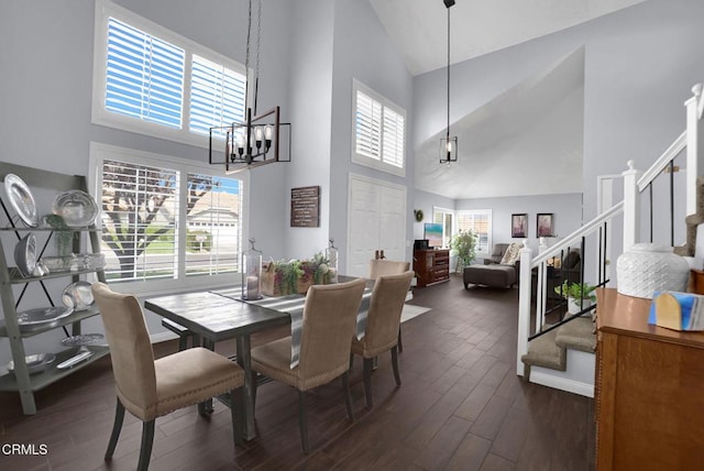 885 Oakland Hills Dr, Banning, CA 92220 - dining room with high vaulted ceiling, dark wood-style floors, stairs, and a chandelier