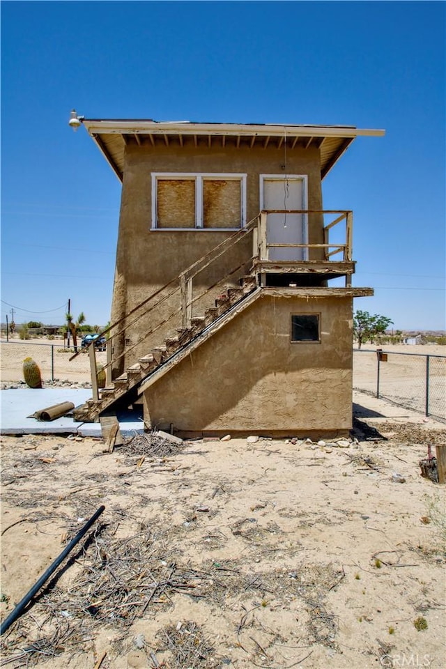 62853 Desert Trail Dr, Joshua Tree, CA 92252 - rear view of property with stucco siding