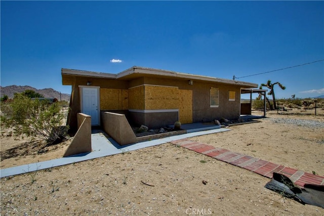 62853 Desert Trail Dr, Joshua Tree, CA 92252 - rear view of house with a mountain view