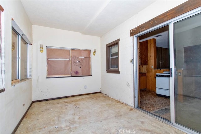 62853 Desert Trail Dr, Joshua Tree, CA 92252 - unfurnished room with unfinished concrete flooring and baseboards