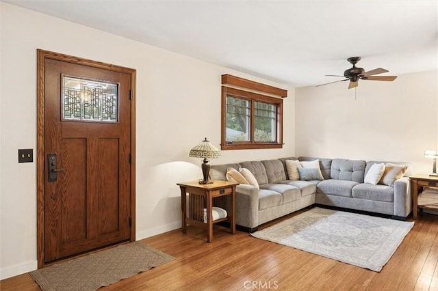 6950 Navarette Ave, Atascadero, CA 93422 - living room featuring plenty of natural light, light wood-style floors, ceiling fan, and baseboards
