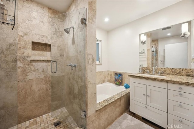6950 Navarette Ave, Atascadero, CA 93422 - full bathroom with a garden tub, a stall shower, vanity, and recessed lighting