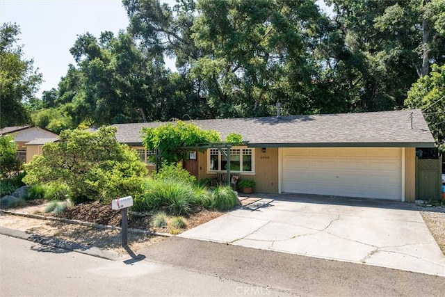 6950 Navarette Ave, Atascadero, CA 93422 - view of front of house featuring an attached garage, driveway, and roof with shingles