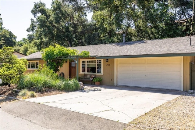 6950 Navarette Ave, Atascadero, CA 93422 - single story home with concrete driveway, a garage, roof with shingles, and covered porch