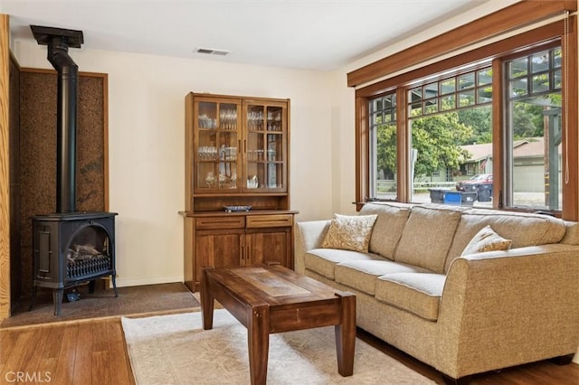 6950 Navarette Ave, Atascadero, CA 93422 - living room with a wood stove and dark wood-style floors