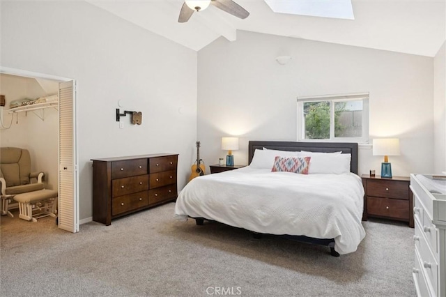 6950 Navarette Ave, Atascadero, CA 93422 - bedroom featuring light colored carpet, a skylight, ceiling fan, a closet, and high vaulted ceiling