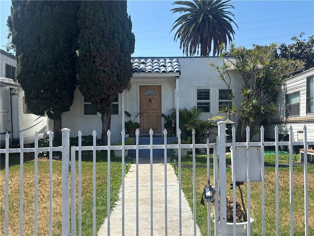 1322 W 97th St, Los Angeles, CA 90044 - view of front of property with a tile roof and stucco siding
