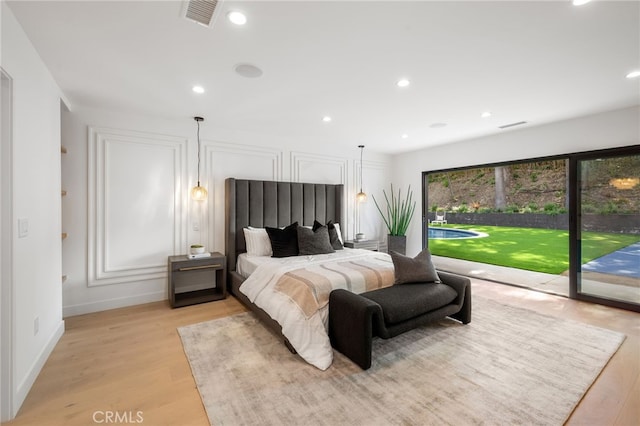 20215 Lorenzana Dr, Woodland Hills, CA 91364 - bedroom with access to exterior, light wood-style flooring, recessed lighting, and baseboards