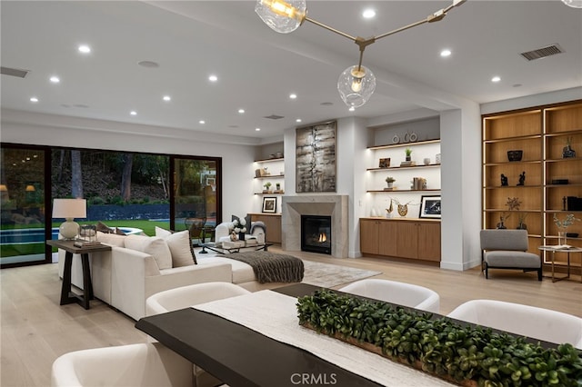 20215 Lorenzana Dr, Woodland Hills, CA 91364 - living room featuring light wood-type flooring, a glass covered fireplace, and recessed lighting