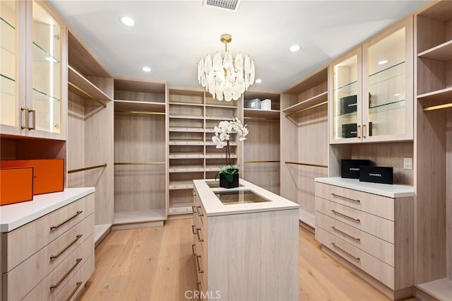 20215 Lorenzana Dr, Woodland Hills, CA 91364 - spacious closet with a chandelier and light wood-type flooring