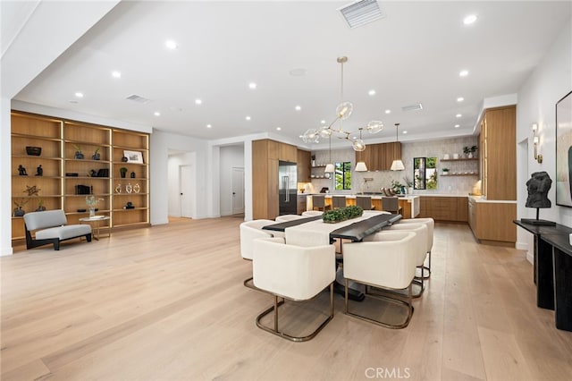 20215 Lorenzana Dr, Woodland Hills, CA 91364 - dining area featuring recessed lighting, light wood finished floors, and a chandelier