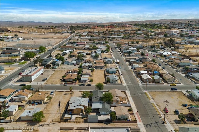 605 E Fredricks St, Barstow, CA 92311 - aerial view of property's location featuring a mountain backdrop and nearby suburban area