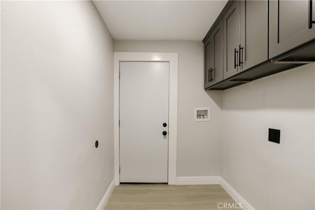 605 E Fredricks St, Barstow, CA 92311 - washroom with cabinet space, light wood-style flooring, baseboards, and hookup for a washing machine