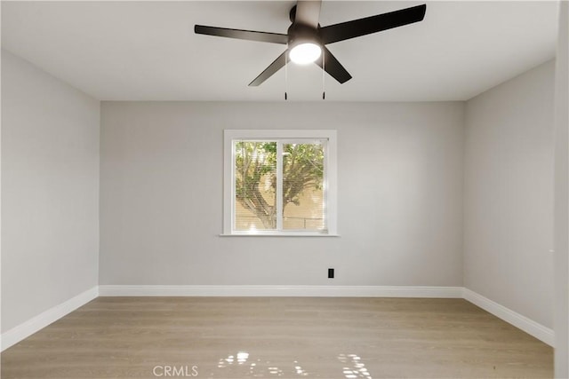 605 E Fredricks St, Barstow, CA 92311 - spare room featuring light wood finished floors, a ceiling fan, and baseboards