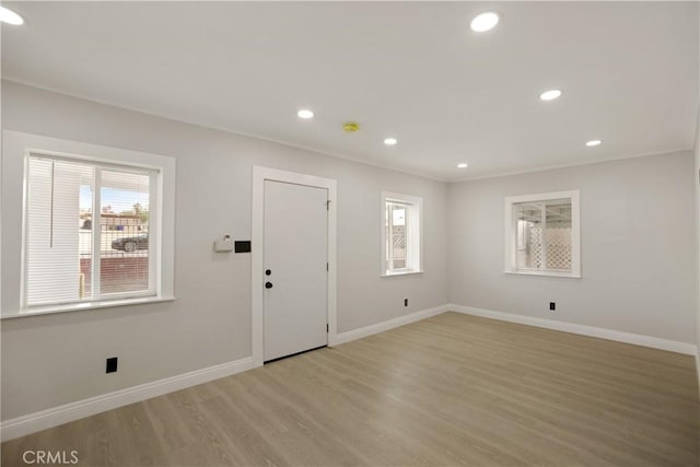 605 E Fredricks St, Barstow, CA 92311 - entryway featuring plenty of natural light, light wood-style flooring, baseboards, and recessed lighting