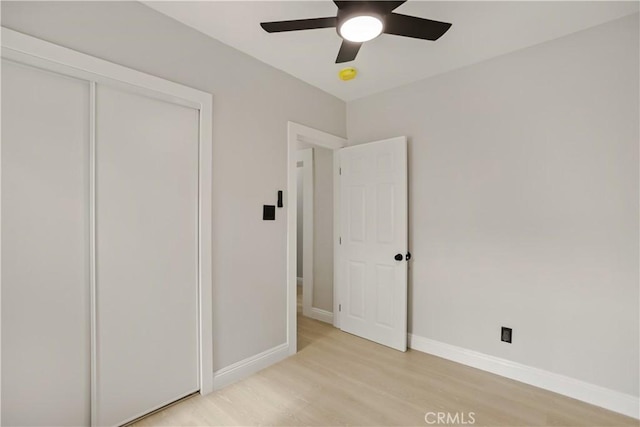 605 E Fredricks St, Barstow, CA 92311 - unfurnished bedroom featuring light wood finished floors, baseboards, a closet, and a ceiling fan