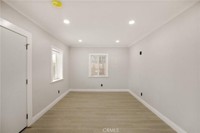 605 E Fredricks St, Barstow, CA 92311 - spare room with recessed lighting, light wood-type flooring, baseboards, and a smoke detector