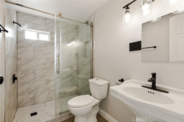 605 E Fredricks St, Barstow, CA 92311 - full bath with toilet, a stall shower, a sink, and baseboards