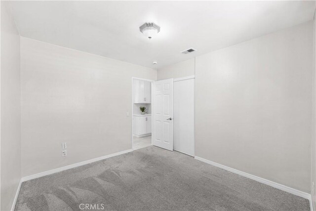 45634 Berkshire St, Lancaster, CA 93534 - spare room with baseboards and light carpet