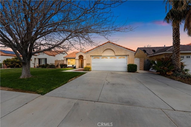 45634 Berkshire St, Lancaster, CA 93534 - view of front of property with concrete driveway, stucco siding, an attached garage, and a front yard