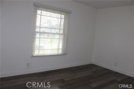1679 N 2nd Ave, Upland, CA 91784 - empty room with plenty of natural light and dark wood-type flooring