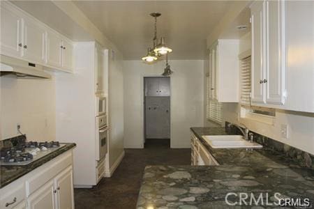 1679 N 2nd Ave, Upland, CA 91784 - kitchen with gas stovetop, under cabinet range hood, white cabinets, and oven
